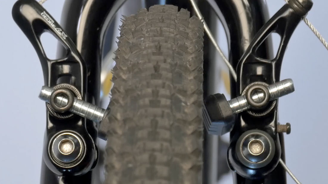 Center arms to rim before adjusting pads