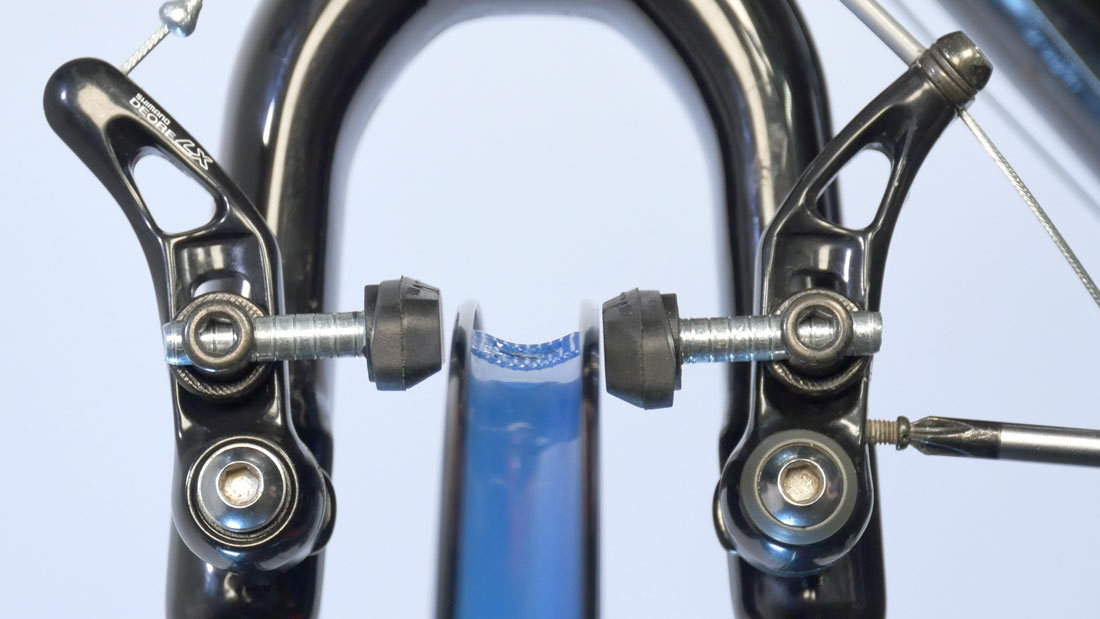 Use centering screw to change relative spring tension left-to-right