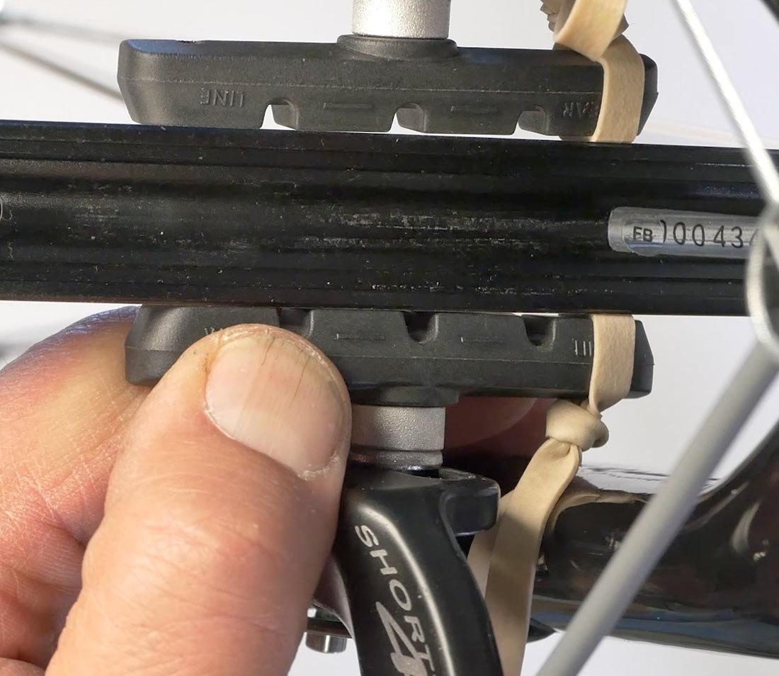 Using shim at back of pad to set brake toe