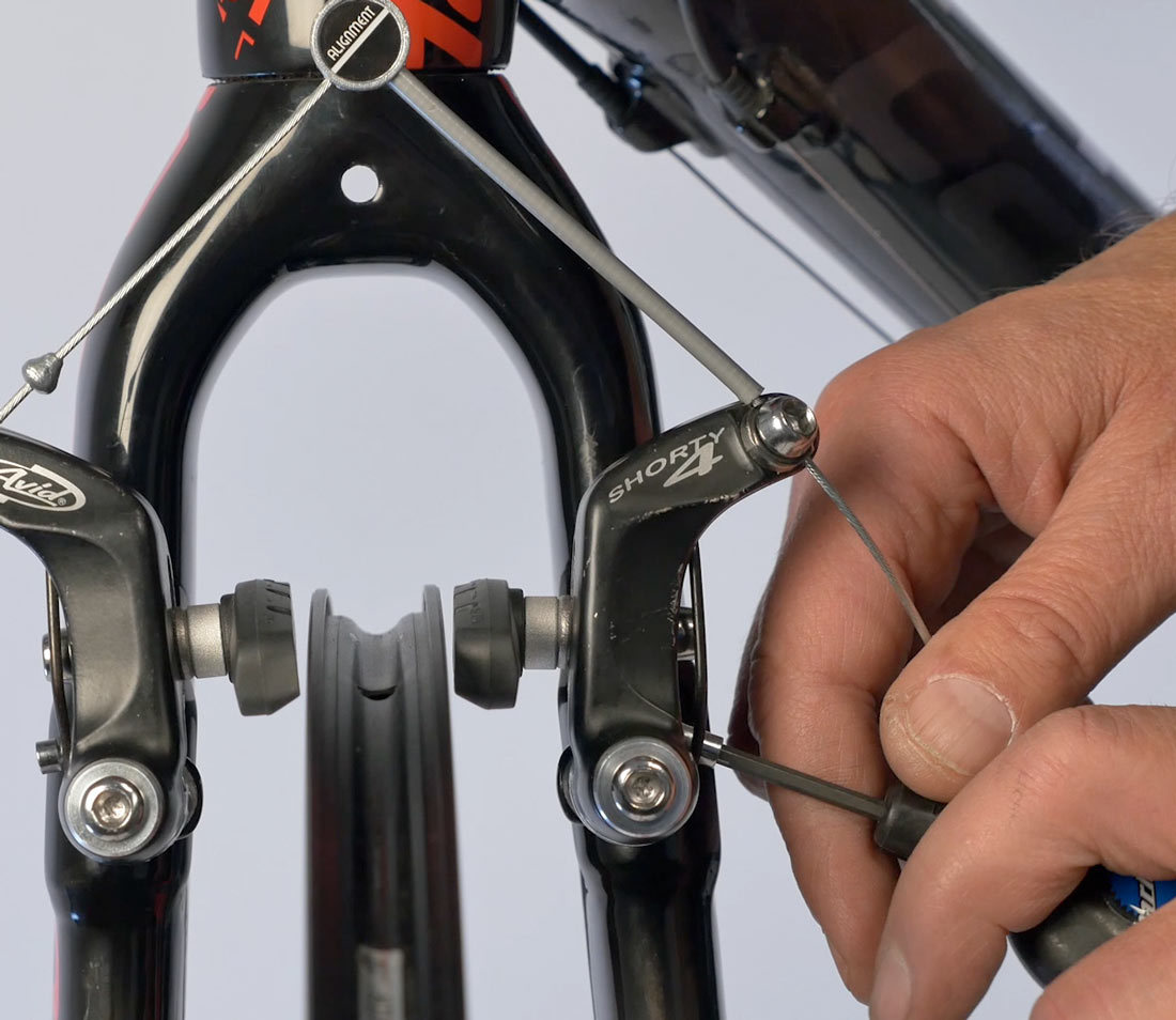 Centering screws to change relative spring tension left-to-right