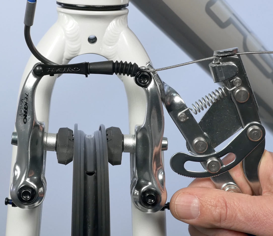 Draw slack from cable and secure pinch bolt