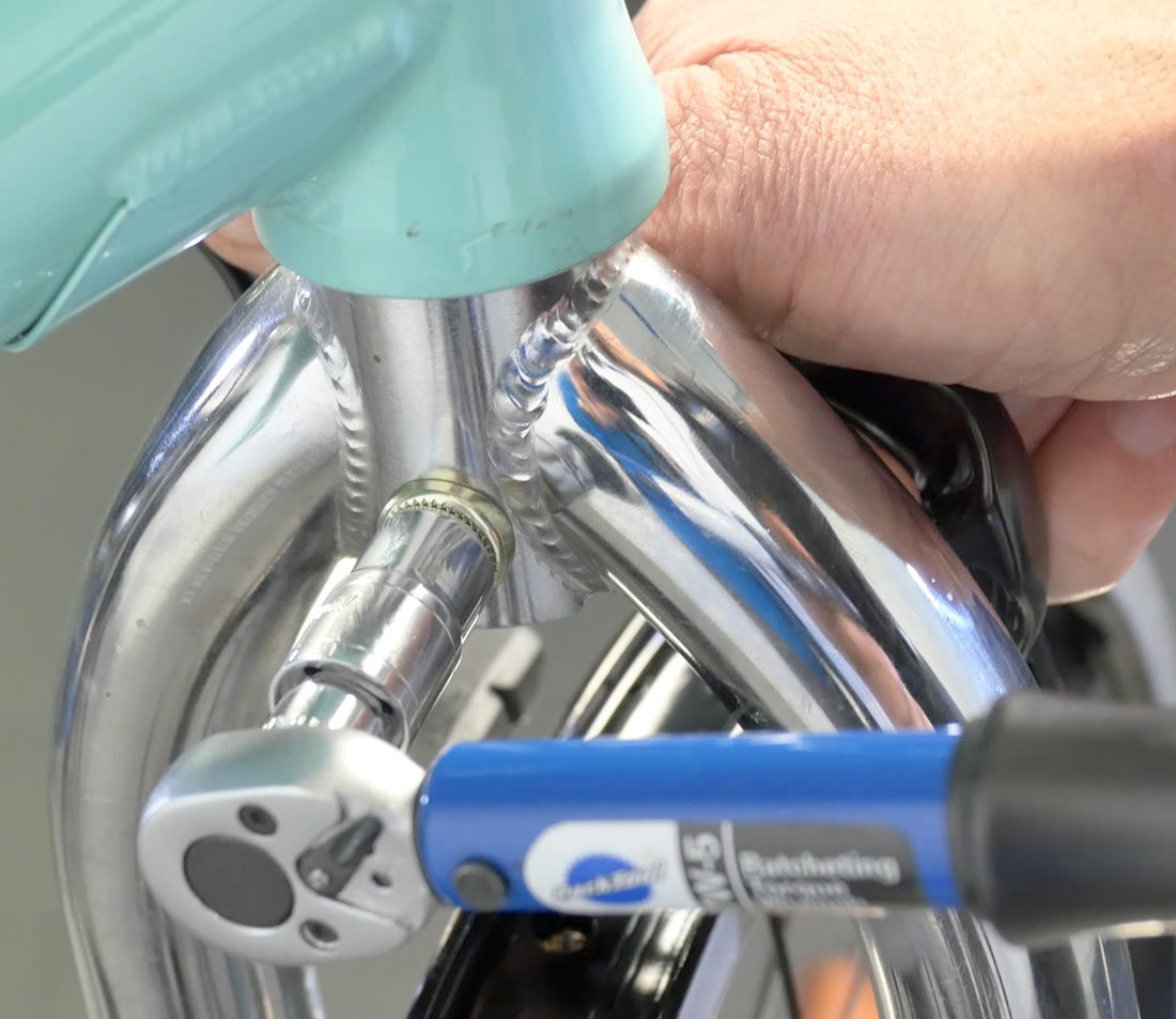 Secure the side pull mounting nut