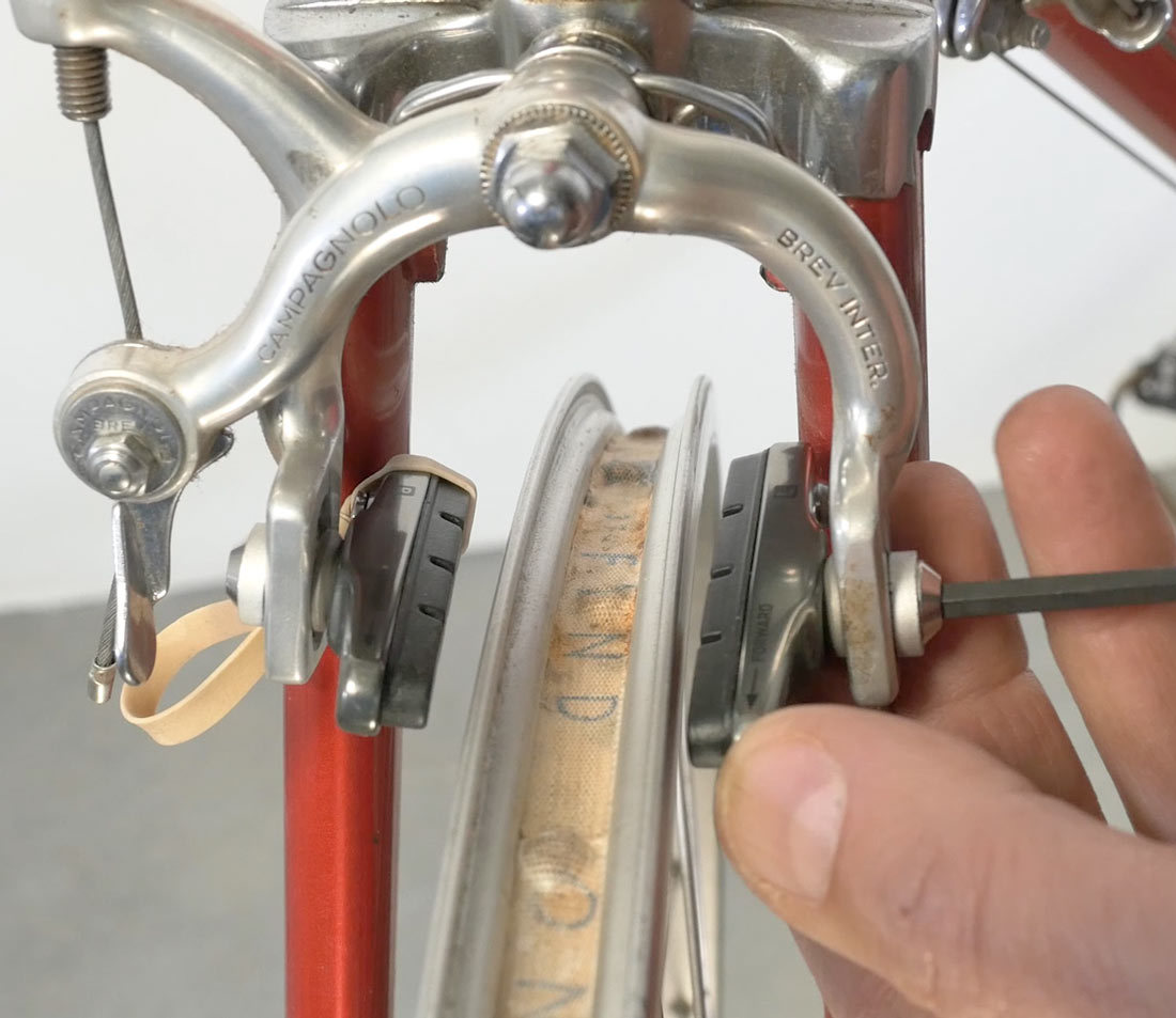 Convex-concave washer system to set toe without bending arms