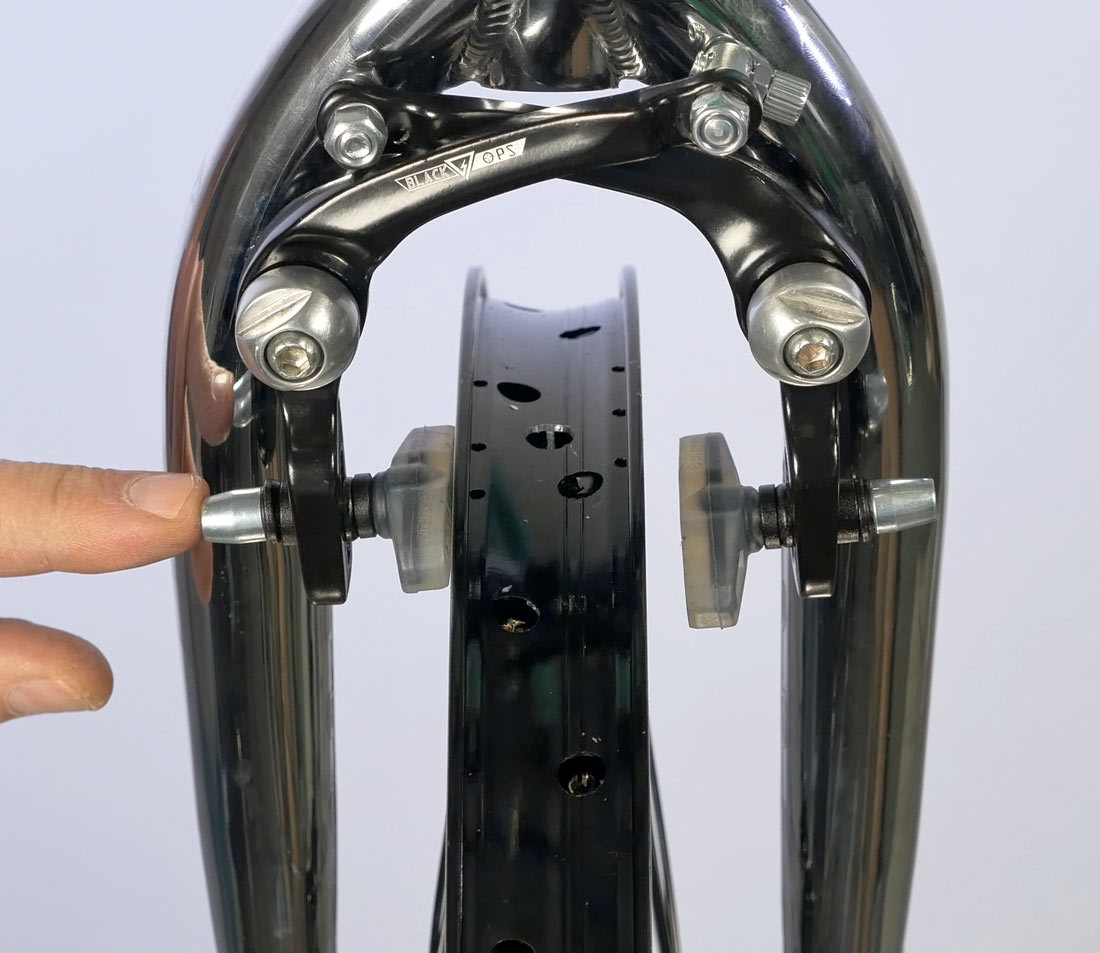 Loosen brake mount to bring pad to rim with spring tension