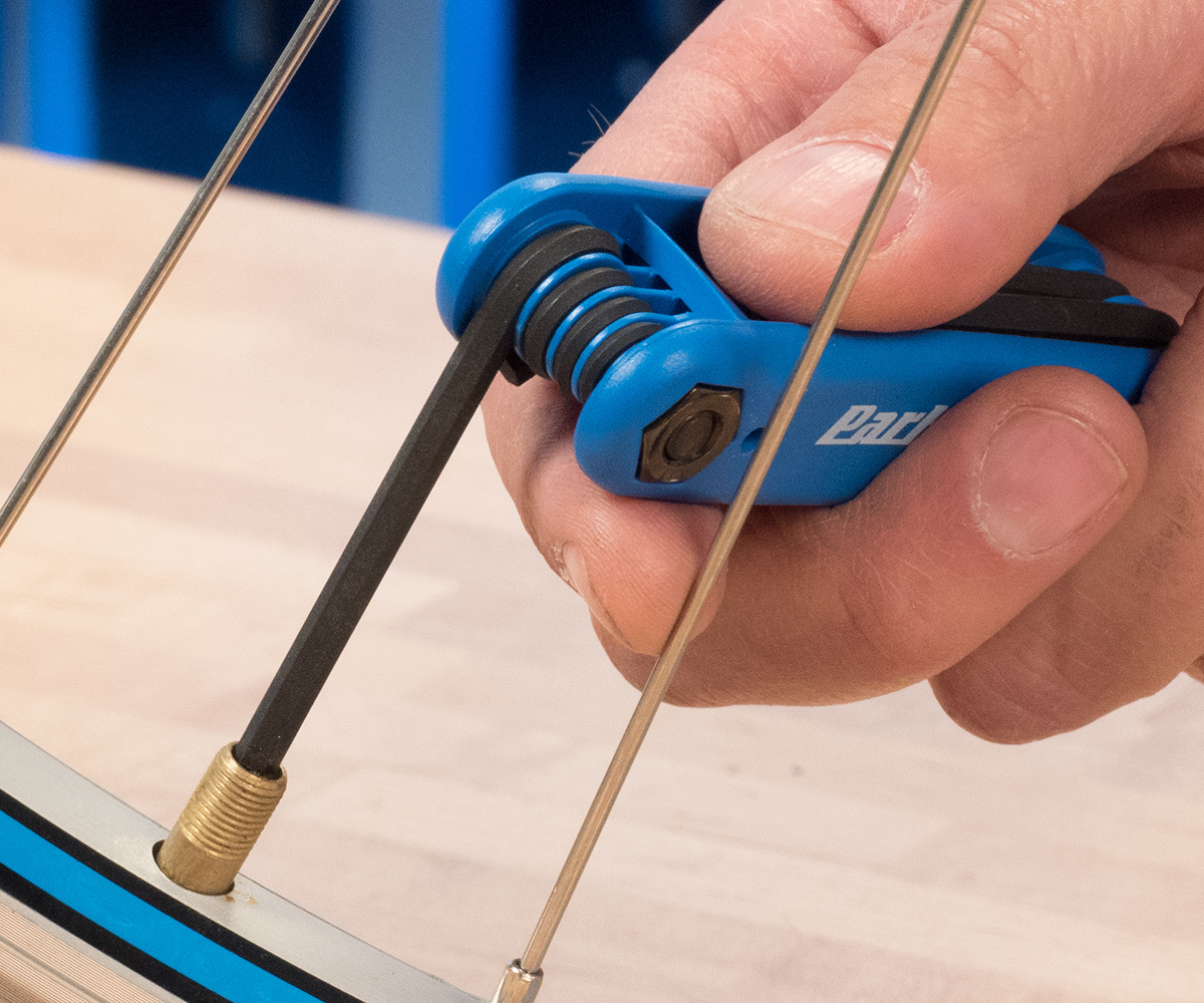 use a small tool such as a hex wrench to depress the plunger inside a Schrader valve