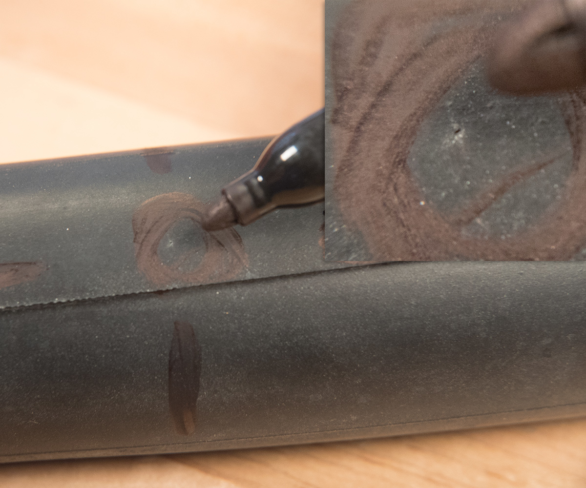 Small pinhole indicating a puncture