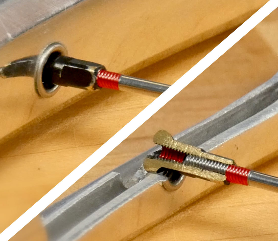 Detail of a spoke that is too short, with excess thread showing at the nipple