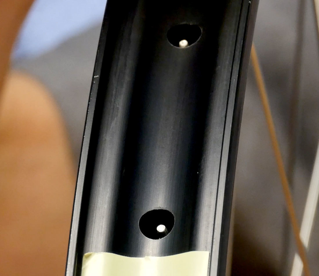 Bare rim strip revealing spokes that are too long