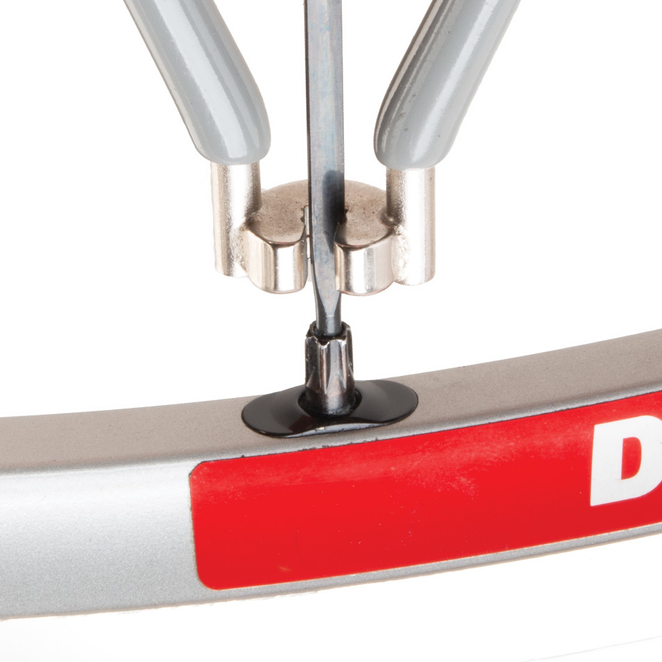 Gray SW-5 spoke wrench being fitted to DT Swiss® Tricon spoke nipple on wheel