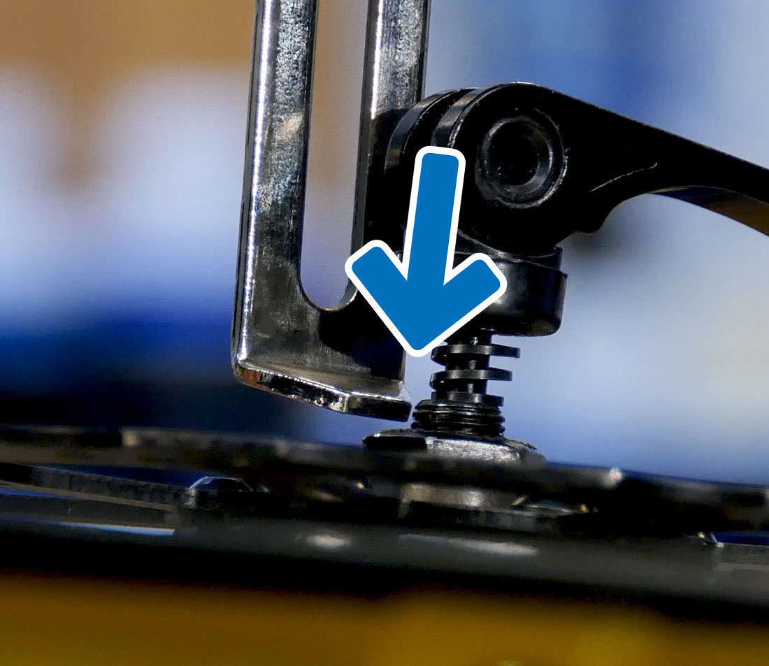 Closeup of indicator at hub contact point with arrow showing it has gotten closer to the hub